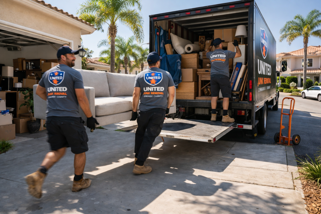 same day junk removal Orange County crew loading couch in Anaheim driveway